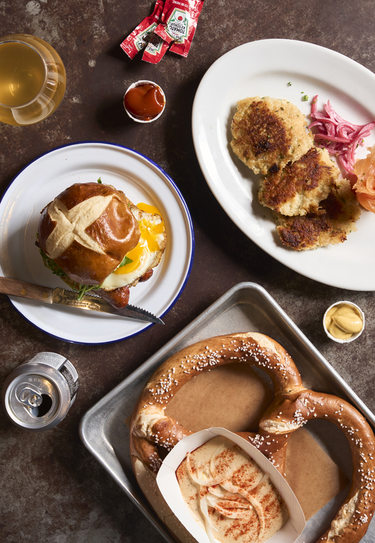 German meal: pretzel, schnitzel, roulade, mustard, sauces.